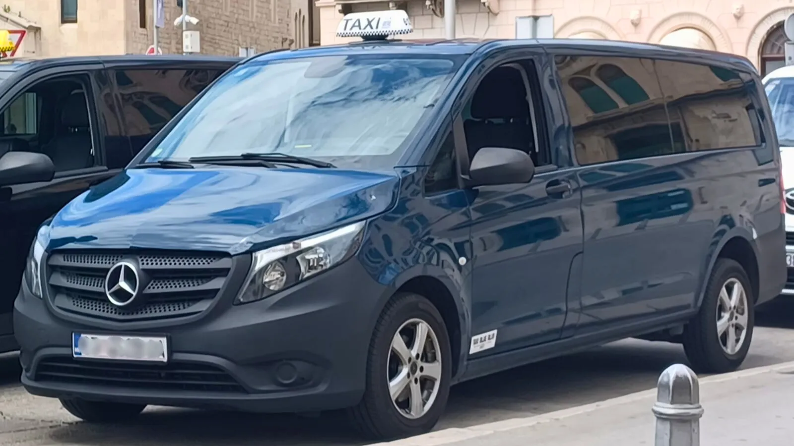 image of two taxz vans